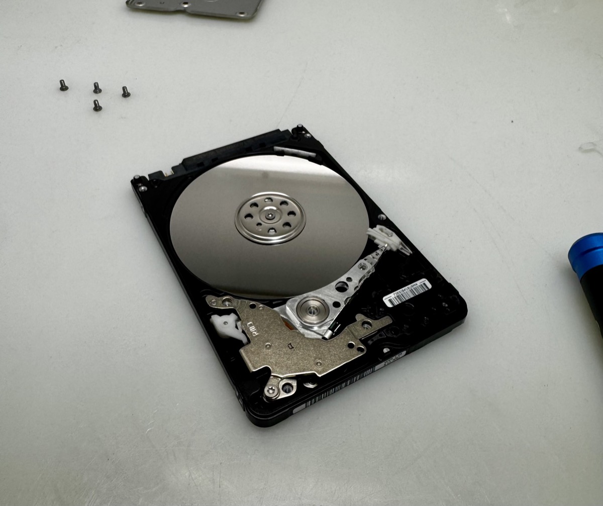 A failed hard drive opened in a clean room for head replacement and platter imaging